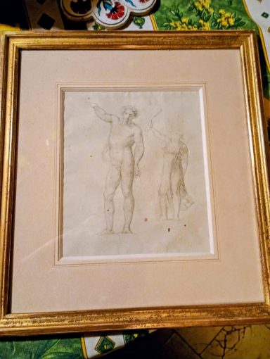 Croquis représentant un homme nu et une silhouette debout, encadré sous verre.